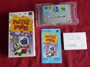Puzzle Bobble (Super Nintendo NTSC-J) fotografia portada-cartucho y manual.jpg