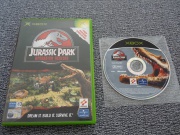 Jurassic Park Operation Genesis (Xbox) fotografia caratula delantera y disco.jpg